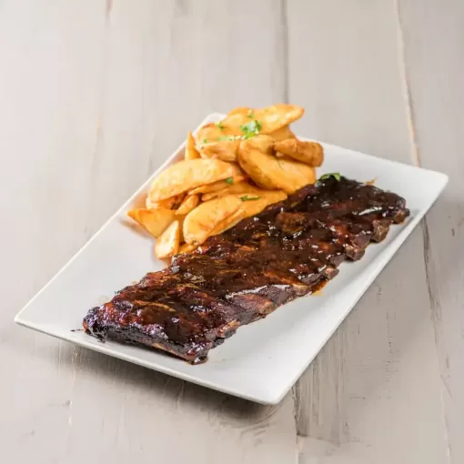 Coaste de porc la cuptor în sos Barbeque